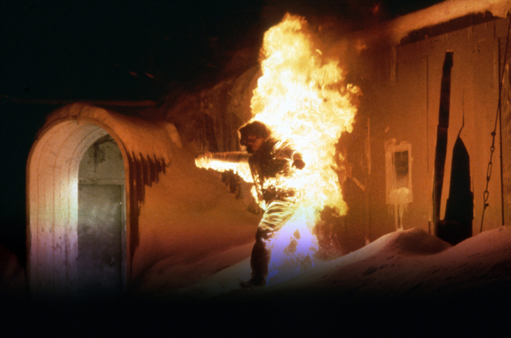 At the end of The Thing (1982) when MacReady and Childs were sitting down  when the camp was burning down, was one of them infected? Was it convenient  for the “Thing” because